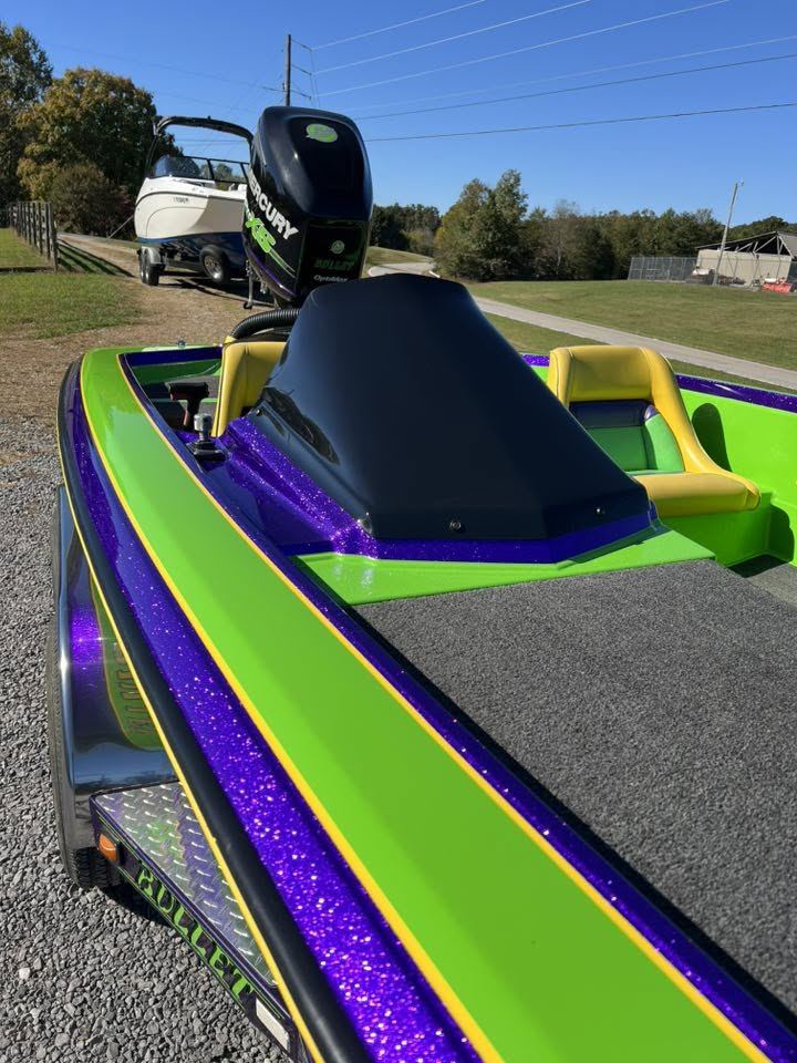 Purple metal-flake and lime green deck on a bass boat